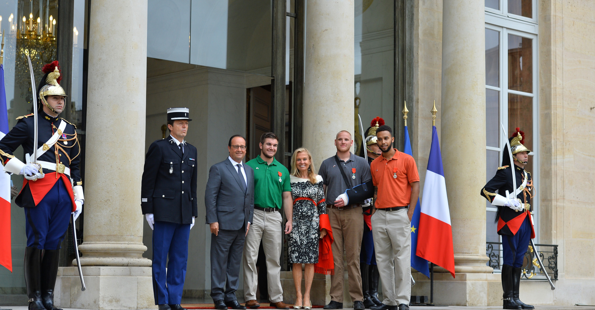 French President Francois Hollande (L) poses with Americans Alek Skarlatos (2nd L), Spencer Stone (2nd R) and Anthony Sandler (L), and US ambassador to France Jane D. Hartley (C) after a ceremony in their honor at the Elysee Palace, in Paris, France on August 24, 2015. The three American friends and British man Chris Norman have been awarded the Legion of Honor medal for bravery. They prevented a massacre aboard a Thalys high-speed train en route to Paris from Amsterdam on Friday when a heavily armed Moroccan gunman known as Ayoub El Khazzani opened fire. Photo by Christian Liewig/Sipa USA